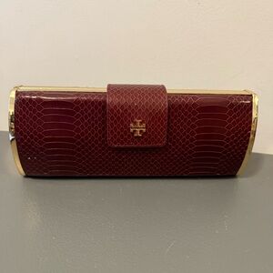 Tory Burch burgundy clutch with gold hardware